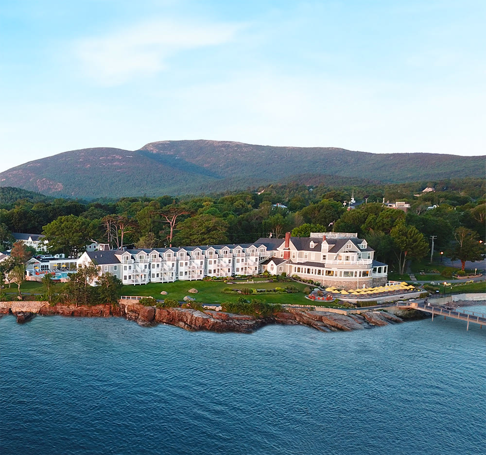 Bar Harbor Inn — white resort on the rocky shore beneath Cadillac Mountain